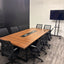 Walnut conference table in the RŌST Coffee meeting room