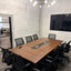 Wide view of the meeting room with glass markerboard and entry door
