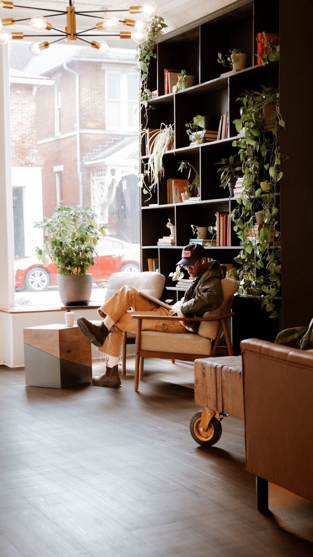 A customer relaxing in a lounge chair inside RŌST Chillicothe